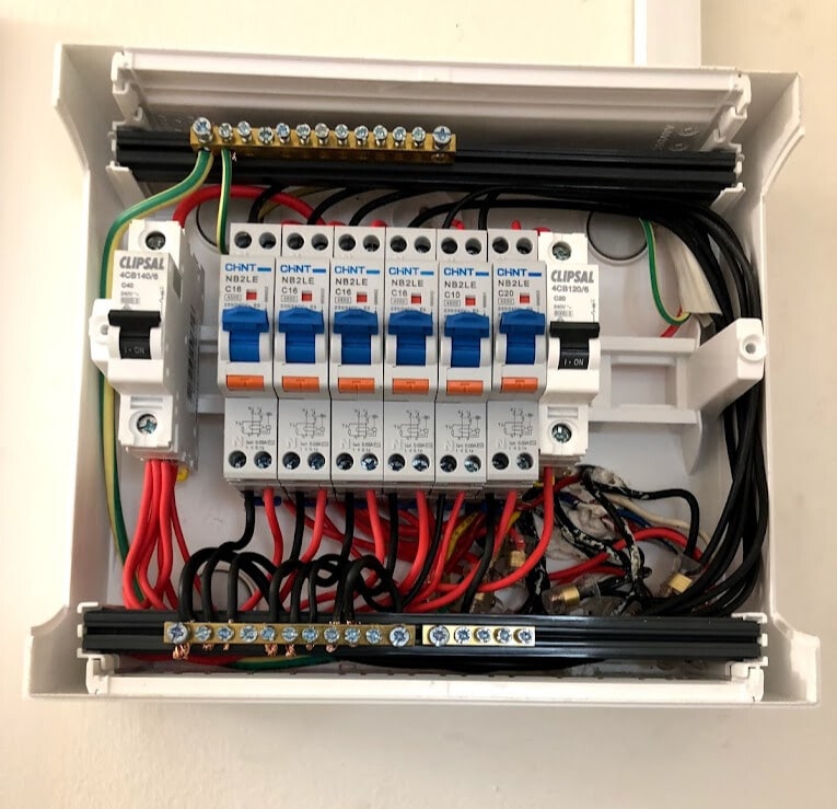 An open electrical panel showing safety switches installed, highlighting safety switch testing services, electrical safety checks and safety switch installation Melbourne by Approved Electrix.