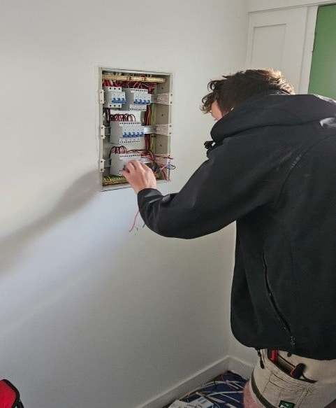 Plumber is checking hot water system